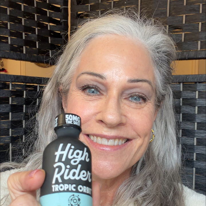 High Rider customer holding two bottles
