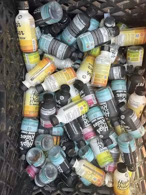 Collection of empty High Rider bottles