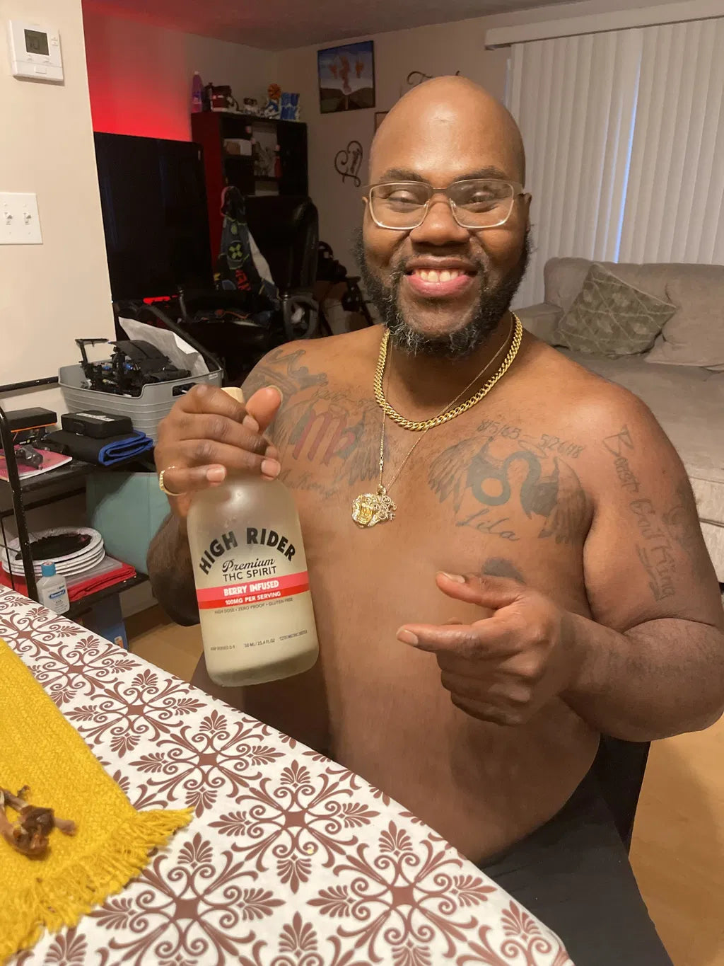 Derrick holding a High Rider Berry THC Spirit bottle