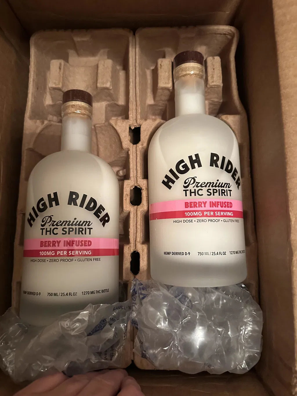 Two High Rider Berry THC Spirit bottles in shipping packaging