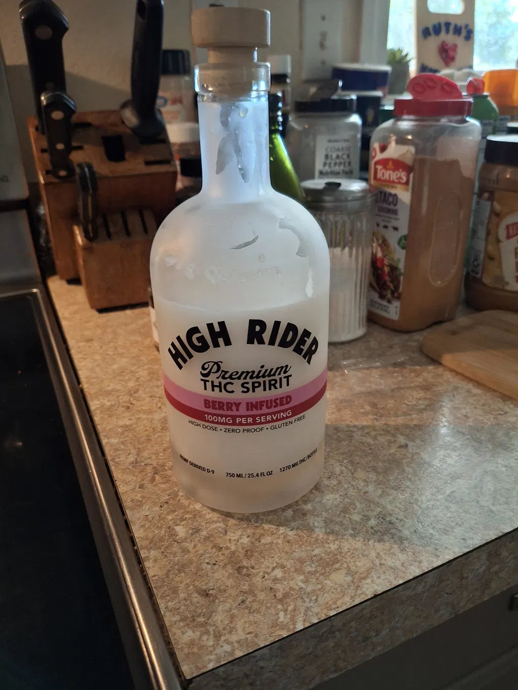 High Rider Berry THC Spirit bottle on a kitchen counter